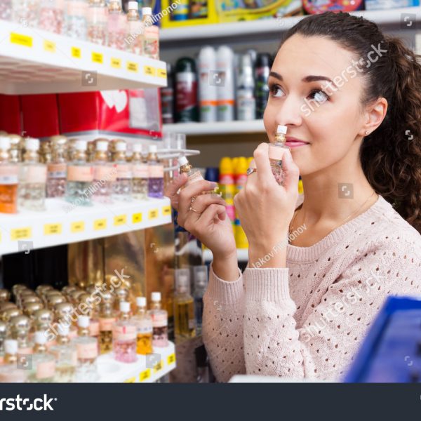 stock-photo-happy-young-woman-choosing-things-for-makeup-and-smiling-in-store-628738208