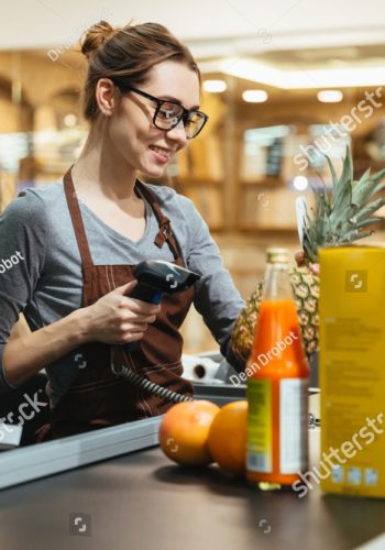 stock-photo-smiling-female-cashier-scanning-grocery-items-at-supermarket-777034621 stock-photo-smiling-female-cashier-scanning-grocery-items-at-supermarket-777034621