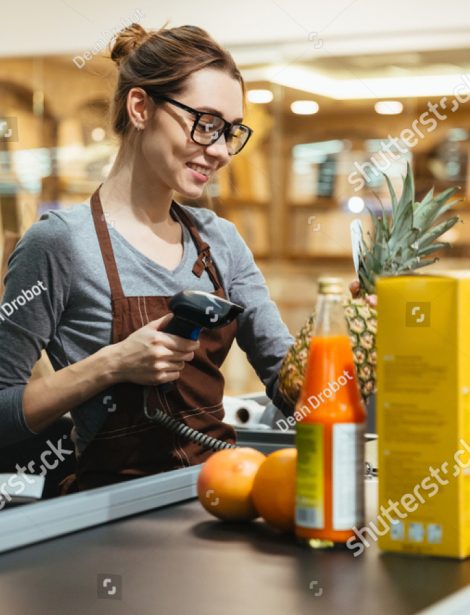 stock-photo-smiling-female-cashier-scanning-grocery-items-at-supermarket-777034621 stock-photo-smiling-female-cashier-scanning-grocery-items-at-supermarket-777034621