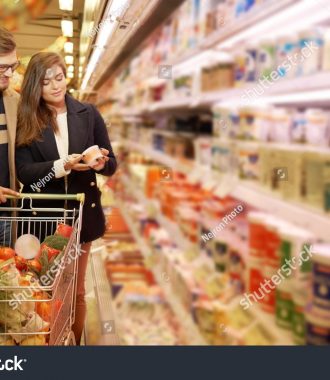 stock-photo-young-couple-in-a-grocery-store-339622673